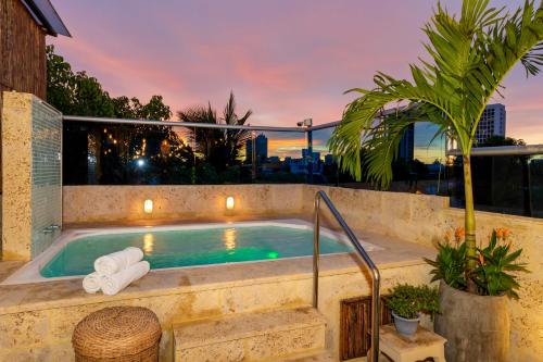 a hot tub on the roof of a house at Hotel Boutique Casa Isabel in Cartagena de Indias