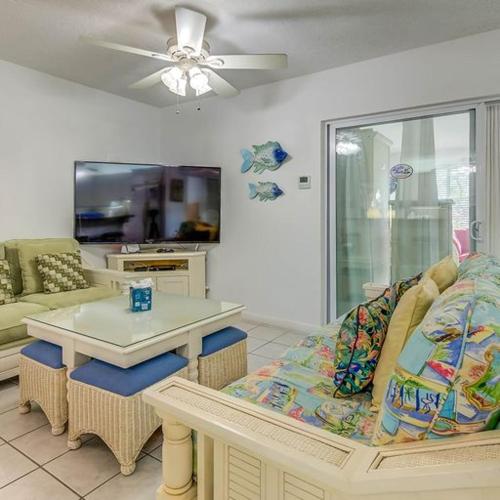 a living room with a couch and a table at Little Bay Compound in Islamorada