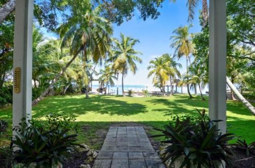 a view of a park with palm trees and the ocean at Little Bay Compound in Islamorada