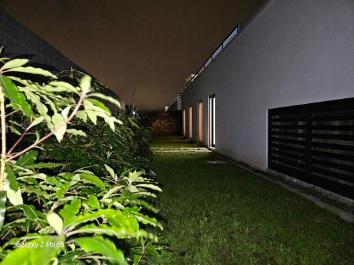 a long hallway of a building with green plants at One of a Kind #PDL Luxury Retreat in Ponta Delgada