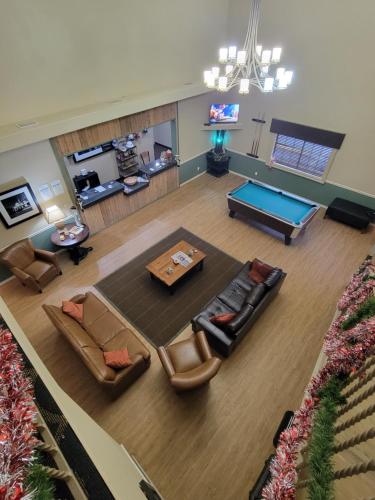 an overhead view of a living room with a pool table at Cotulla Whitten Inn in Cotulla