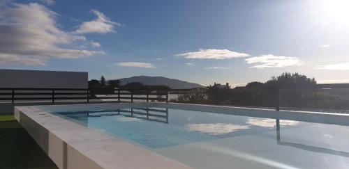 a large swimming pool on top of a building at One of a Kind #PDL Luxury Retreat in Ponta Delgada