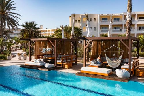 a resort with a swimming pool and a hotel at Sentido Marillia Resort & Spa in Hammamet