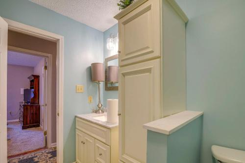 a bathroom with a sink and a toilet in it at Charming Tennessee Retreat with Fireplace and Grill! in Jackson