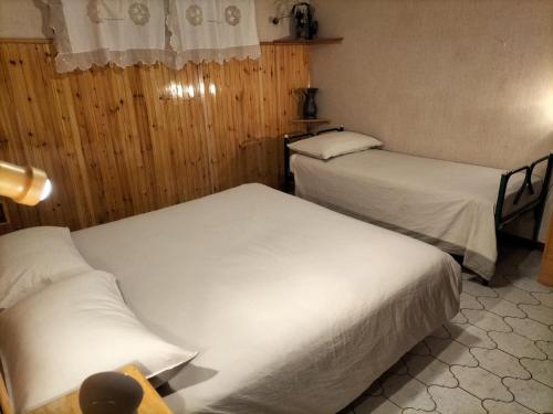 Łóżko lub łóżka w pokoju w obiekcie Casa di Lucy