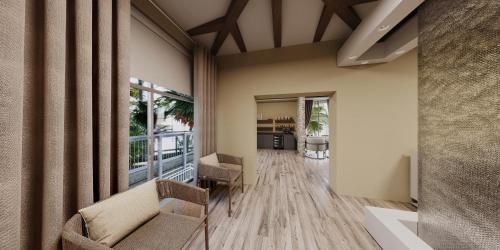 a room with a hallway with chairs and a table at Margaritaville Beach Resort Ft Myers Beach in Fort Myers Beach
