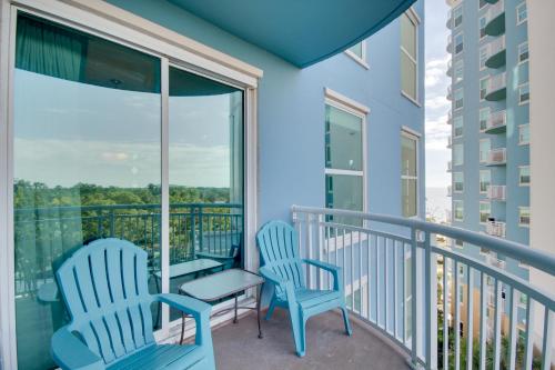 a balcony with two chairs and a table at Gulfport Condo with Views Walk to Beach in Gulfport