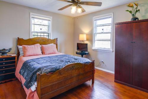 a bedroom with a bed and a ceiling fan at Cozy Memphis Vacation Rental Near Beale Street! in Memphis
