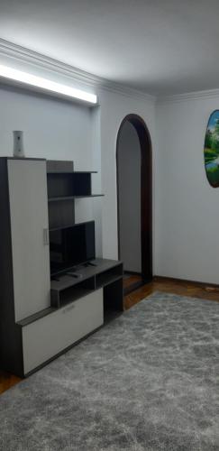 a living room with a flat screen tv on a wall at Сдаётся квартира , посуточно в центре города in Edineţ