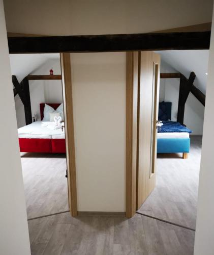 a sliding door in a room with a bedroom at ubytování U NIKY in Hodonín