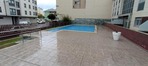 Bazén v ubytování EnFOZ Tus Vacaciones: Playa Piscina y Parking nebo v jeho okolí