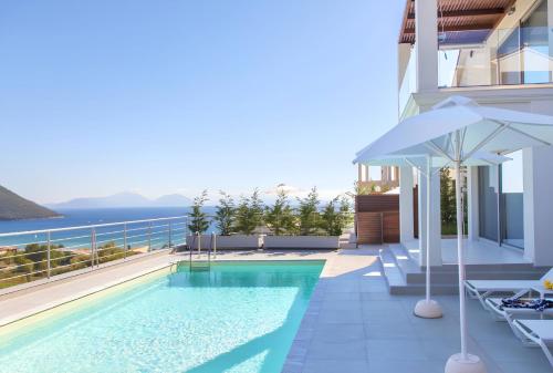 a swimming pool on the balcony of a house at TheBlueHomes Vasiliki in Vasiliki