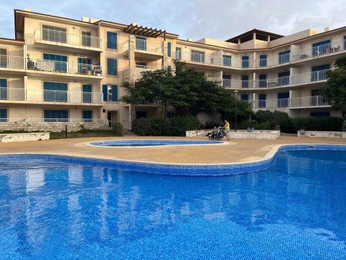 a large swimming pool in front of a building at Holiday Home - Santa Maria in Prainha