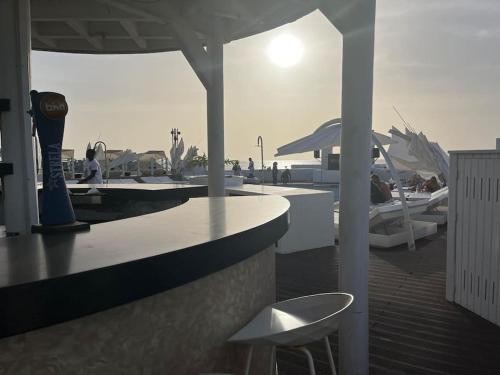 a bar with a table and a chair on a boat at Holiday Home - Santa Maria in Prainha
