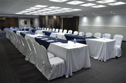 a row of tables and chairs in a room at LaiLa Hotel CDMX Reforma in Mexico City