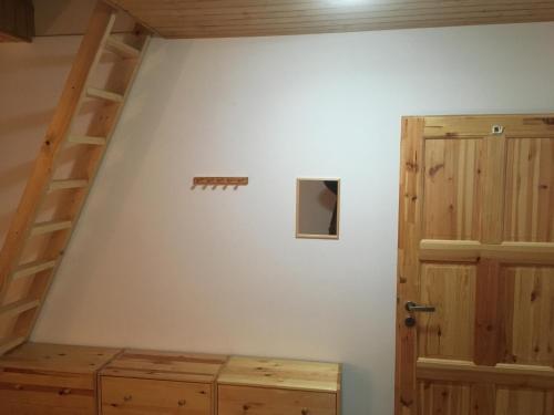 a room with a staircase and a room with a door at U Čmeláka in Vyskeř