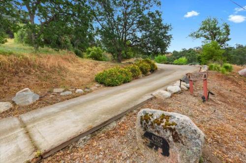 a road with a sign on the side of it at SEQUOIA LOOKOUT LODGE in Three Rivers