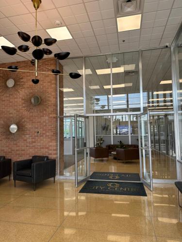 a lobby with a ceiling fan in a building at City Centre of Pascagoula in Pascagoula