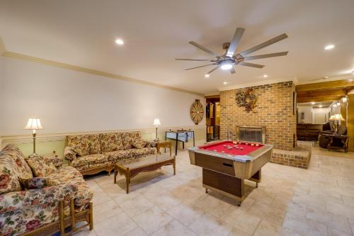 a living room with a pool table and a fireplace at Immaculate Boone Villa with Entertainment Lounge! in Boone
