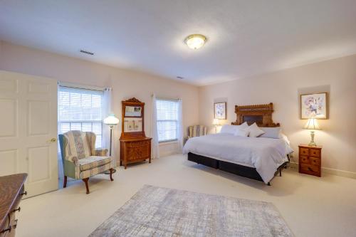 a bedroom with a bed and a desk and a chair at Immaculate Boone Villa with Entertainment Lounge! in Boone