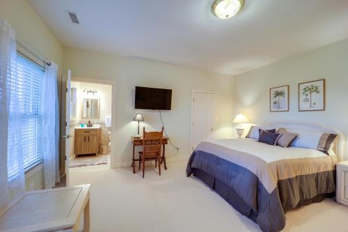 a bedroom with a bed and a desk and a television at Immaculate Boone Villa with Entertainment Lounge! in Boone