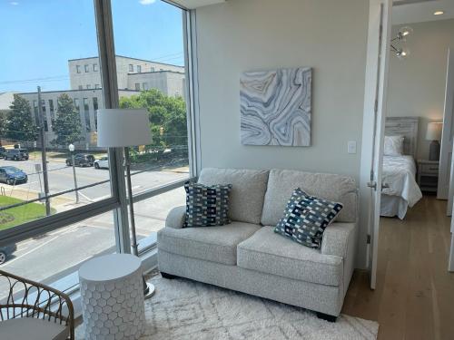 a living room with a couch and a view of a street at City Centre of Pascagoula in Pascagoula