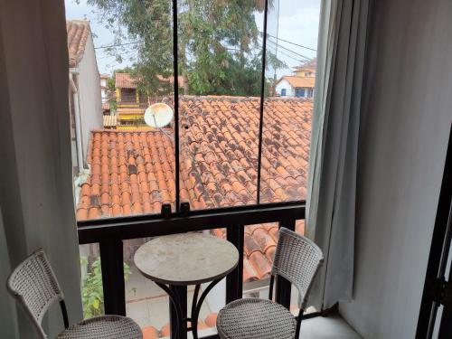 a view of a balcony with a table and chairs at Pousada L'étage in Búzios