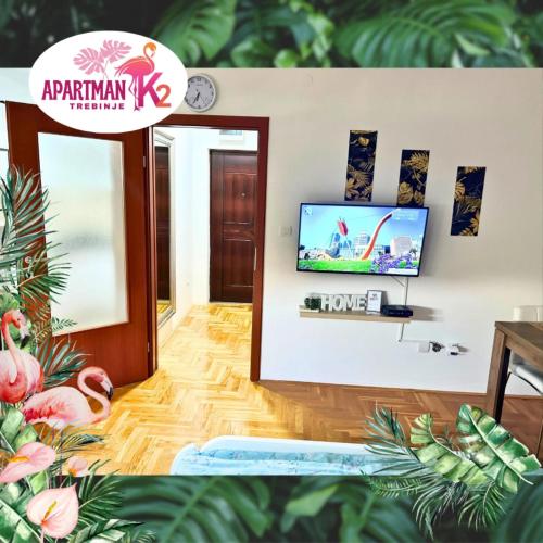 a living room with a tv and a mirror at Studio Apartman K2 in Trebinje