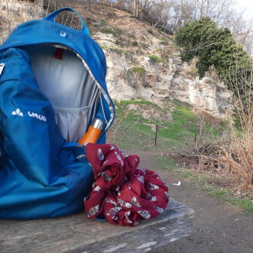 a blue backpack and gloves sitting on a bench at StroEnzo - RUIME LOFT - 5P - 2SLPK - DAKTERRAS - LAADPAAL - 10MIN Maastricht in Riemst