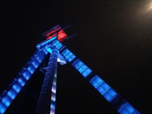 two towers lit up in blue and red at night at VillaEnzo - ELEGANT HERENHUIS - 14P - 6SLPK - SAUNA - INFRAR CABINE - OFYR BBQ - 15MIN Maastricht in Zussen