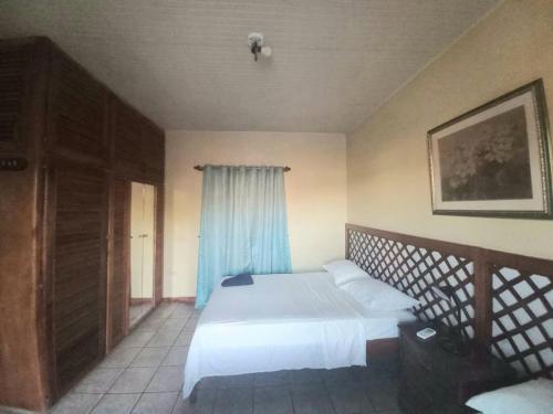 Ένα ή περισσότερα κρεβάτια σε δωμάτιο στο The Seaside Garden Guesthouse