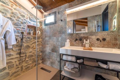 a bathroom with a sink and a shower at Via Roma 33 Tuscany Boutique Hotel & Spa - Adults Only in Stia