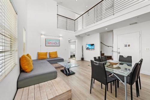 a living room with a couch and a table at Ocean Drive Apartment Suites in Miami Beach in Miami Beach