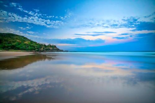 a view of a beach with clouds in the water at Central Location Stylish 3 Bed with Pool - Sunshine Central in Sunshine Beach