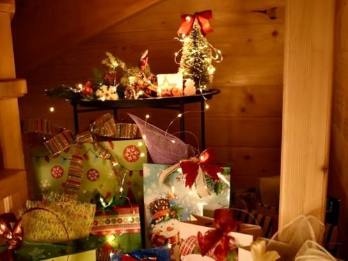 a room with presents and christmas decorations on a shelf at Bilychi - садиба у Карпатах in Bilichi