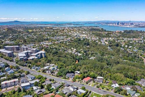 an aerial view of a city with a road at Studio 6 at Tui Treehouse Stay Auckland in Auckland