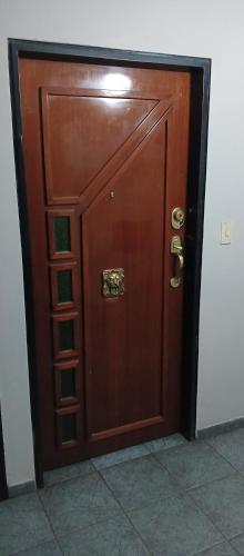 a large wooden door in a room at Apartment nice neighborhood in Maracay