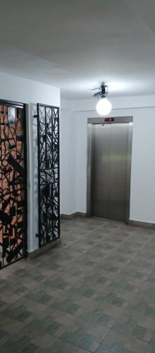 an empty room with a elevator and a door at Apartment nice neighborhood in Maracay
