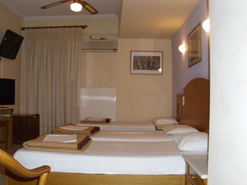 Katil atau katil-katil dalam bilik di Hotel Cybele Pefki