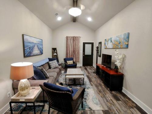a living room with a couch and a tv at Lakeview B - 10 Minutes to Oaklawn Racing & Gaming in Hot Springs