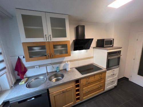 a kitchen with a sink and a counter top at Meli-Vellmar in Vellmar