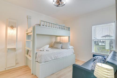 a bedroom with a bunk bed and two windows at Family-Friendly Crystal Beach Home Steps to Beach in Crystal Beach