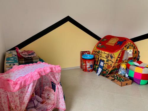 a room with a table and a suitcase at Bilychi - садиба у Карпатах in Bilichi