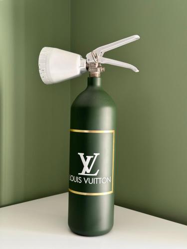 a green wine bottle with a lamp on it at Bel Fiore Deluxe Apartment in Genova