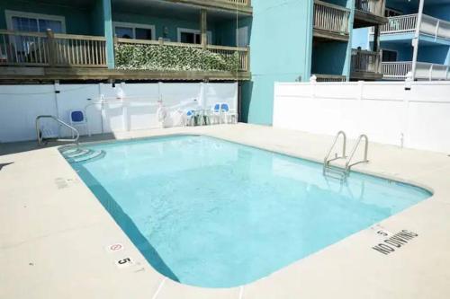 a large swimming pool on top of a building at Living the Dream on the beach! in Carolina Beach