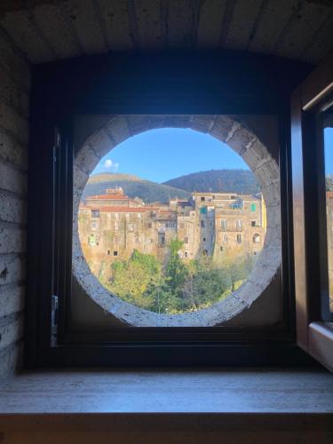 a window with a view of a city at BELLEVUE APARTMENTS in SantʼAgata deʼ Goti