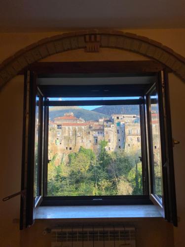 a window with a view of a city at BELLEVUE APARTMENTS in SantʼAgata deʼ Goti