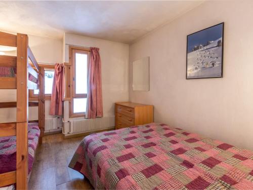 a bedroom with a bed and a window at Appartement Val-d'Isère, 2 pièces, 6 personnes - FR-1-694-160 in Val-d'Isère