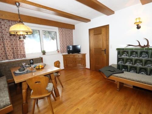 a living room with a table and a dining room at Ferienhaus Wolf in Raut