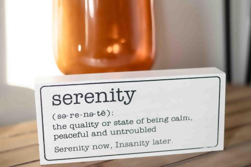 a sign sitting next to a jar of honey at Elegant 1BR 1 Bath apartment minutes the falls in Niagara Falls